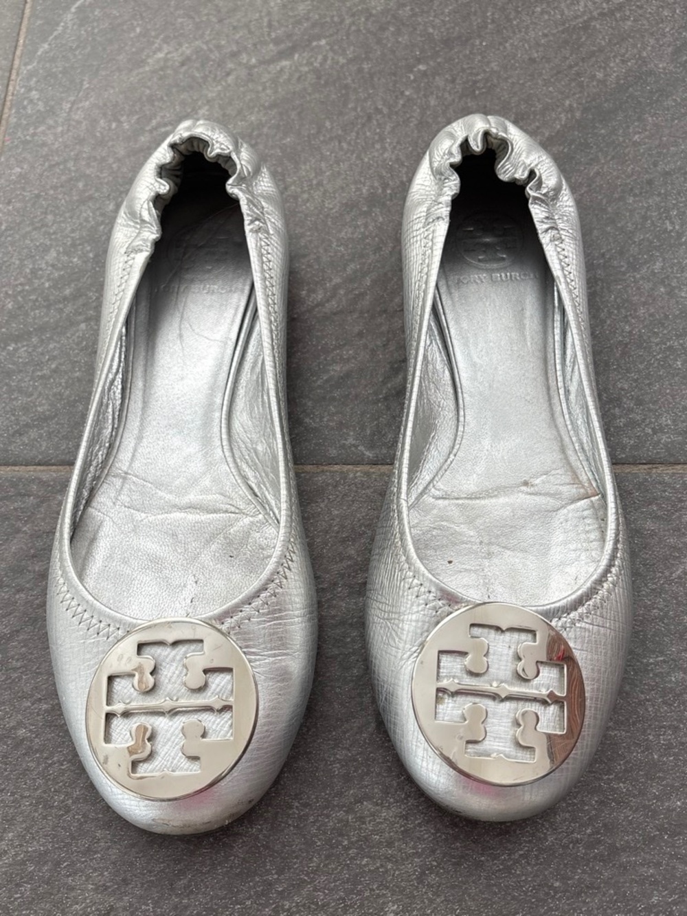 Tory Burch silver ballet flats.